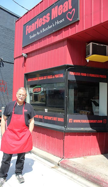 Dave Brown outside the shop
